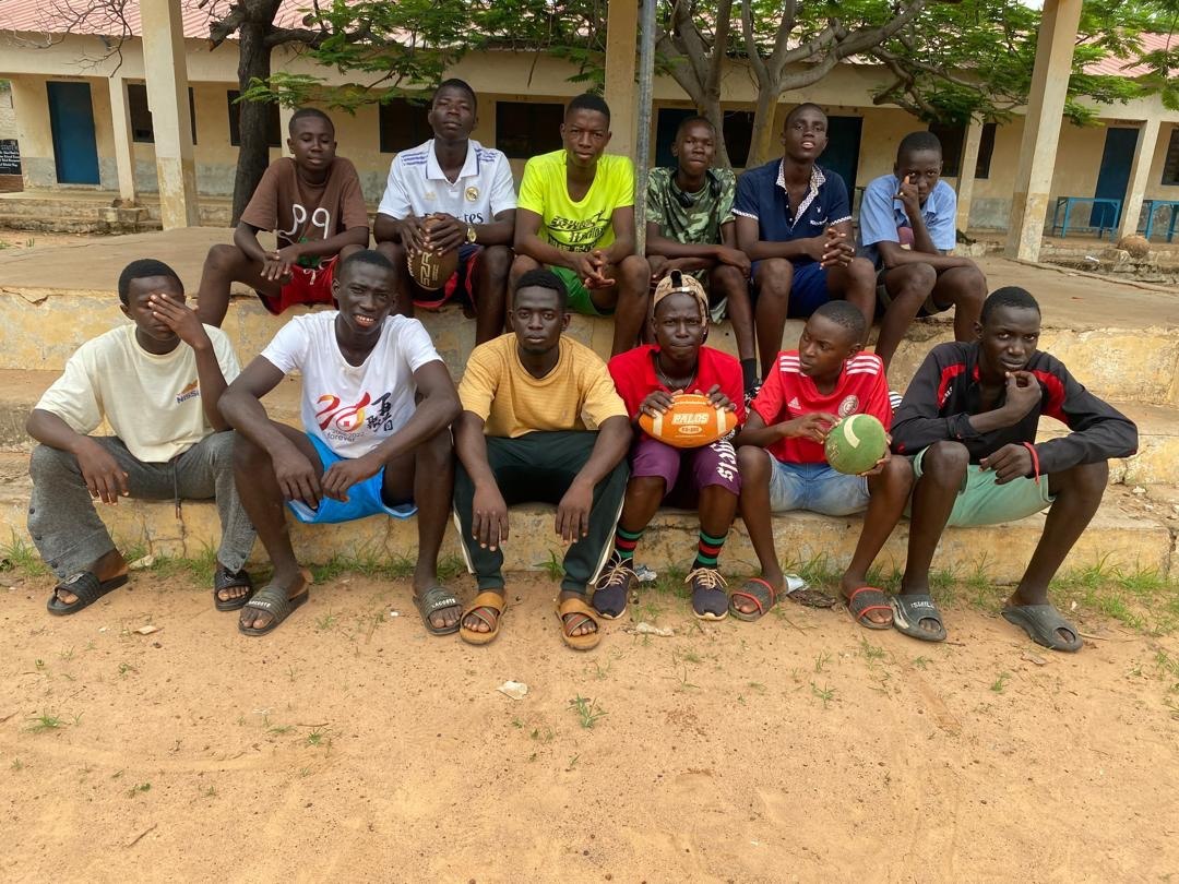 Players gathered with their footballs