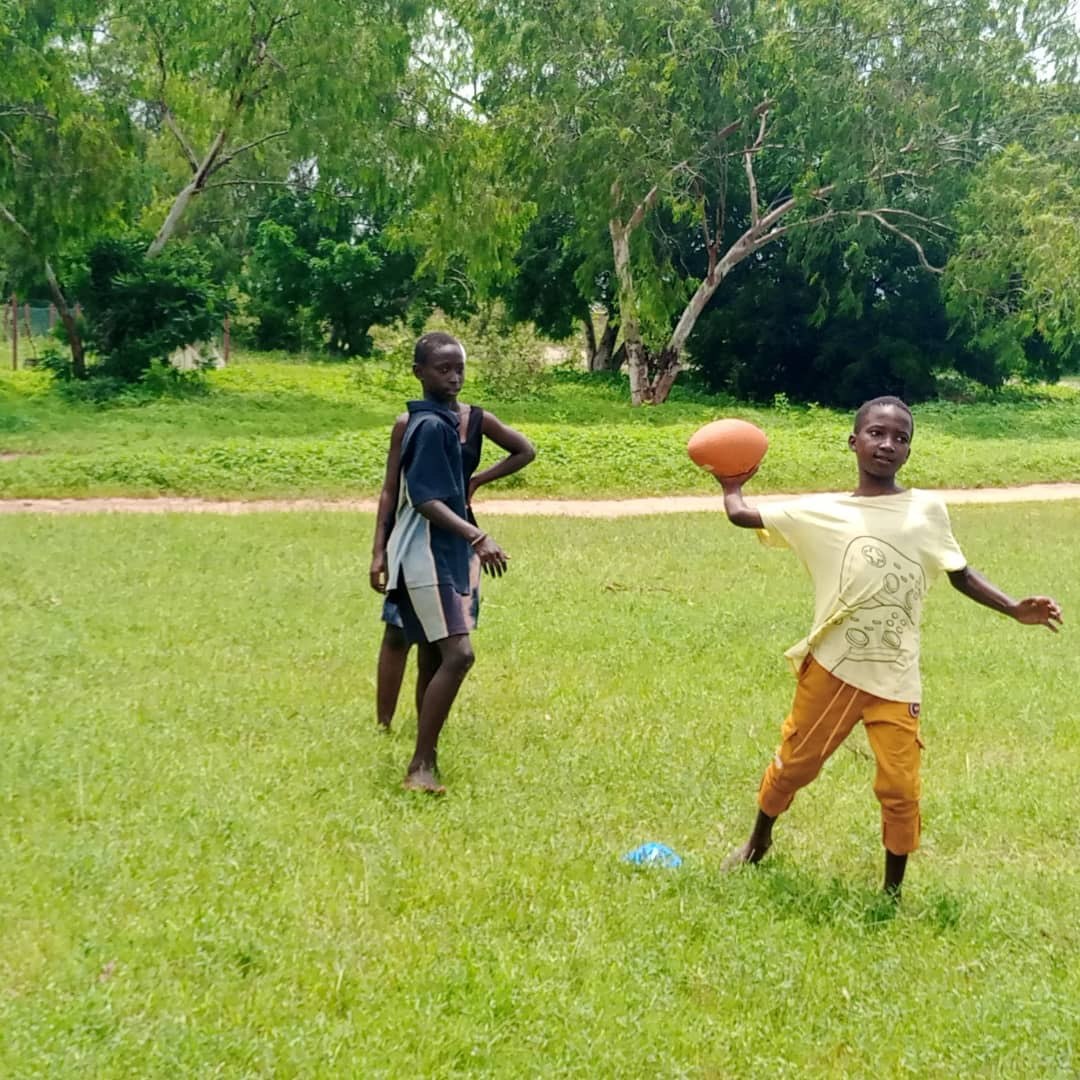 A young player practicing a throw