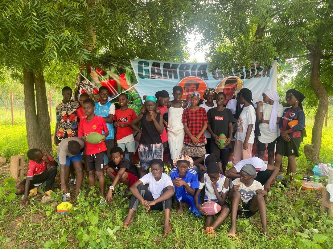 Young players gathered beneath the trees