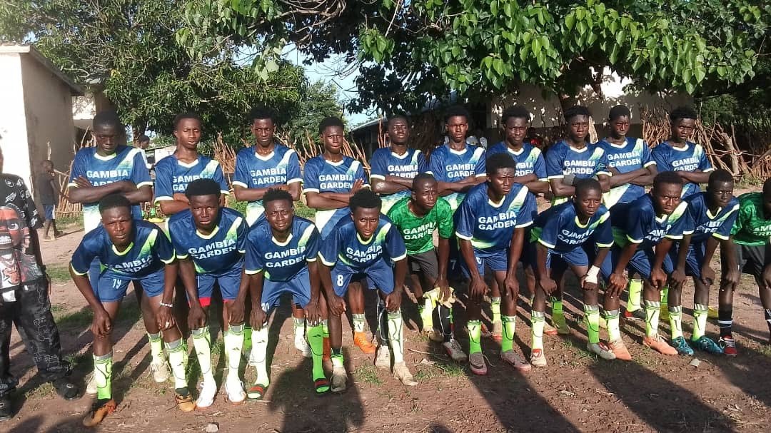The squad together in Gambia Garden jerseys