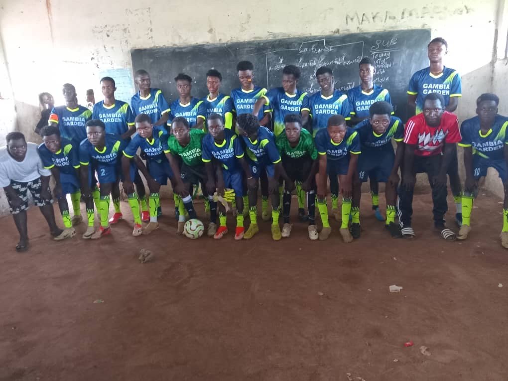 A team photograph in a classroom