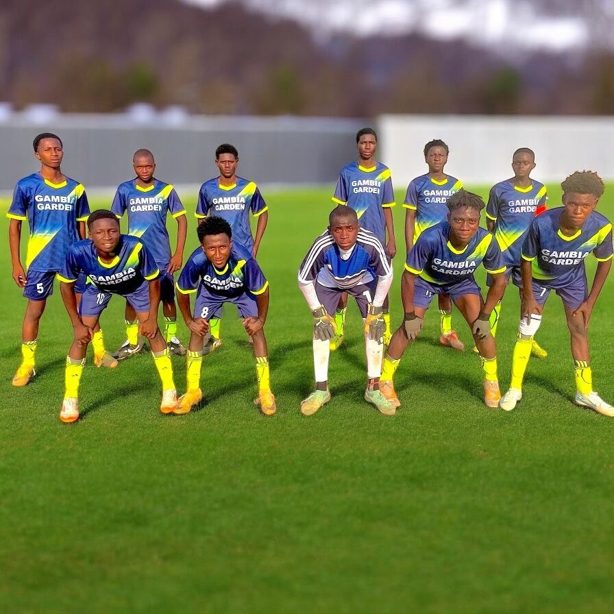 Team portrait on the pitch — supplied artwork